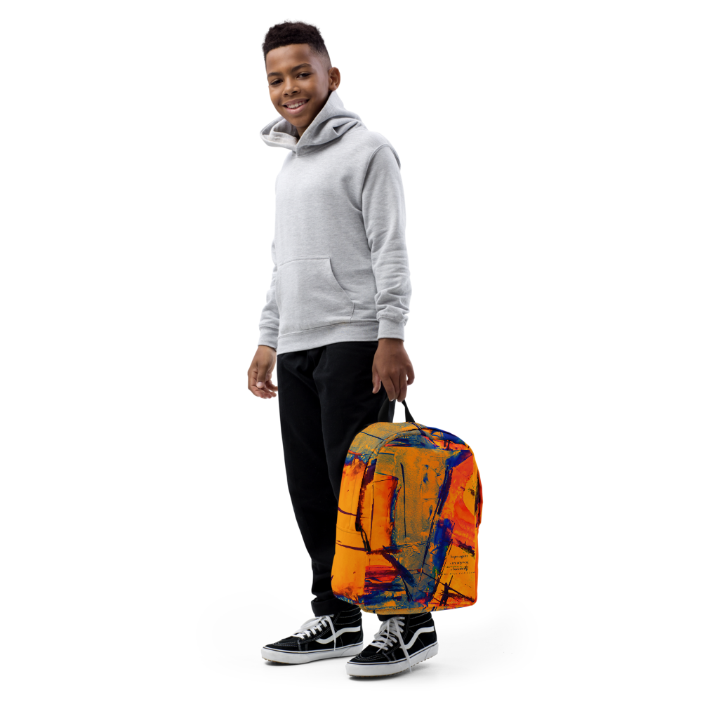A young man wearing a light gray hoodie, black pants, and black sneakers stands against a white background, holding a backpack with an abstract orange, yellow, and blue paint-splatter pattern.